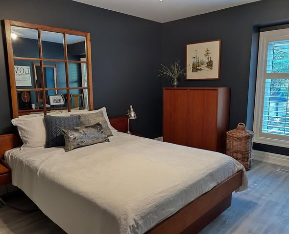 Bedroom finished in a deep, modern navy